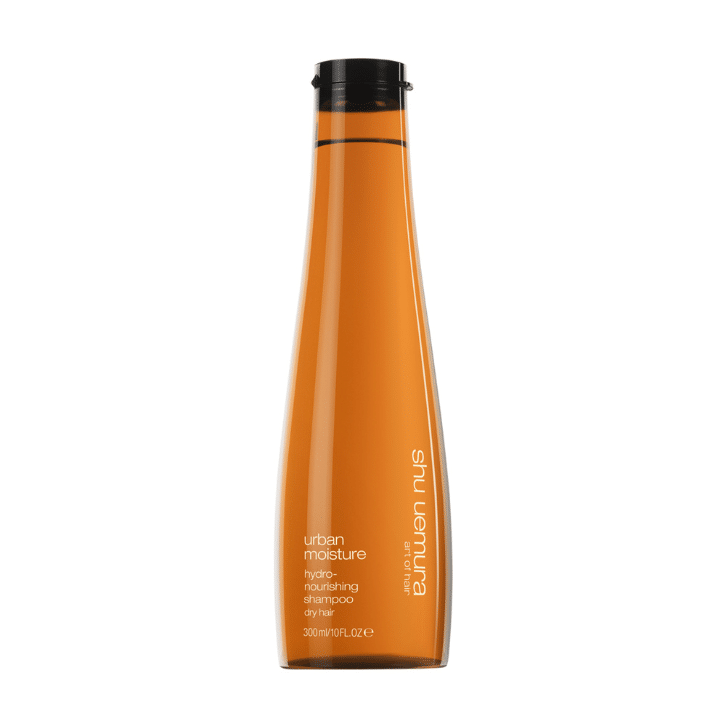 Tube de couleur orange contenant du shampoing pour les cheveux